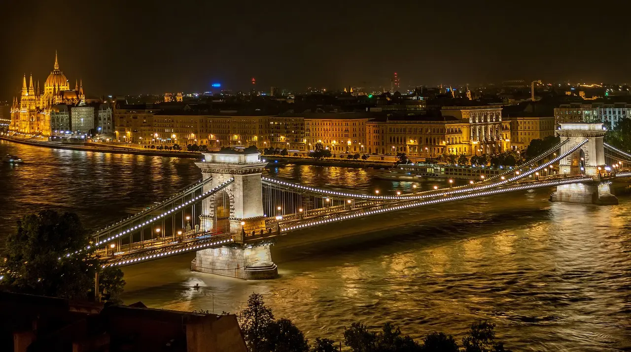 The Széchenyi Chain Bridge lit up at night over the Danube in Budapest