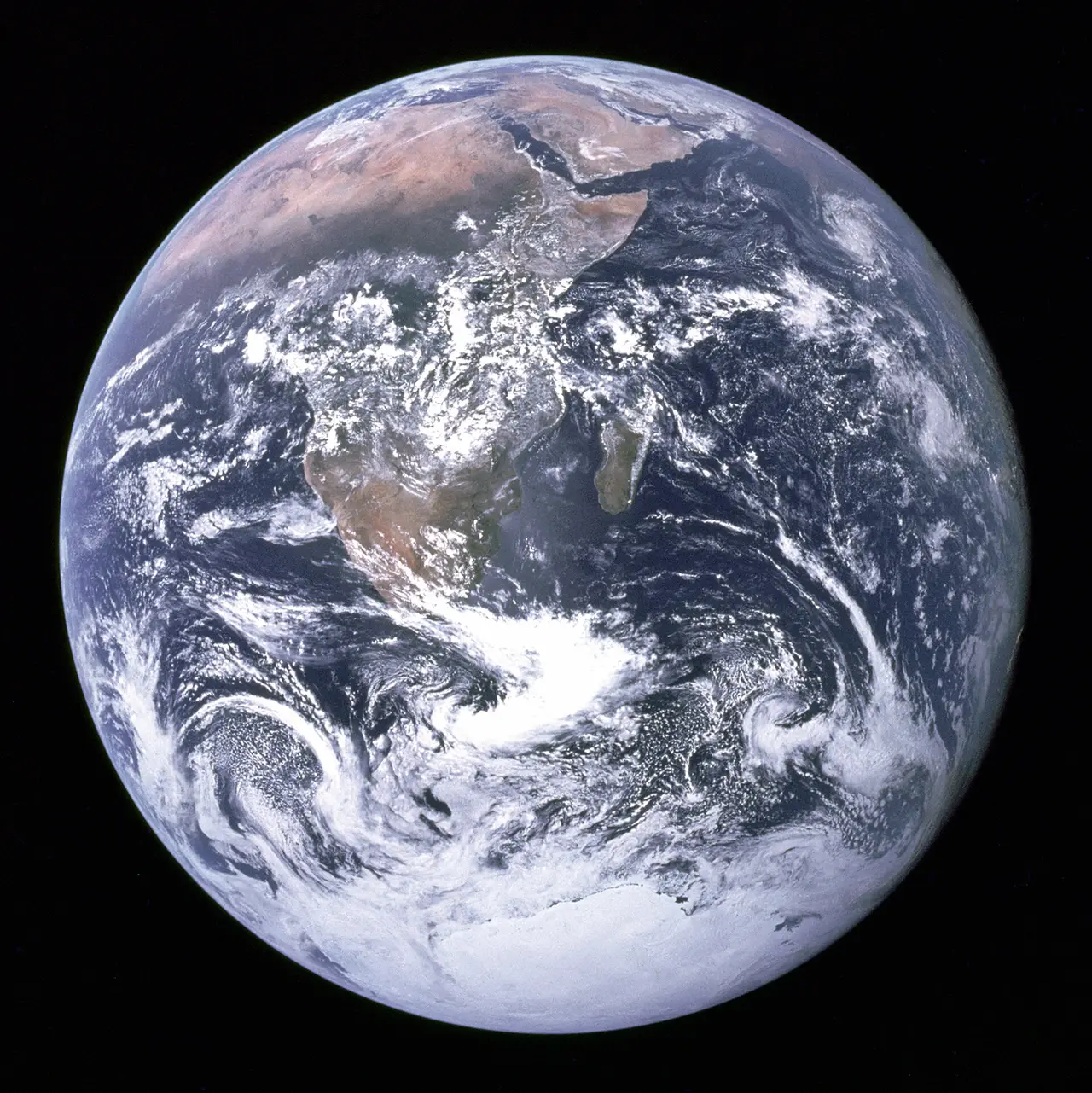 The Earth as a blue and white sphere against black space