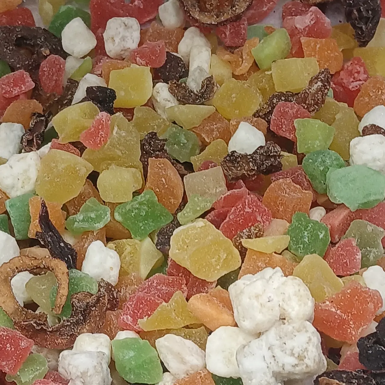 A pile of colourful mixed dried fruit pieces