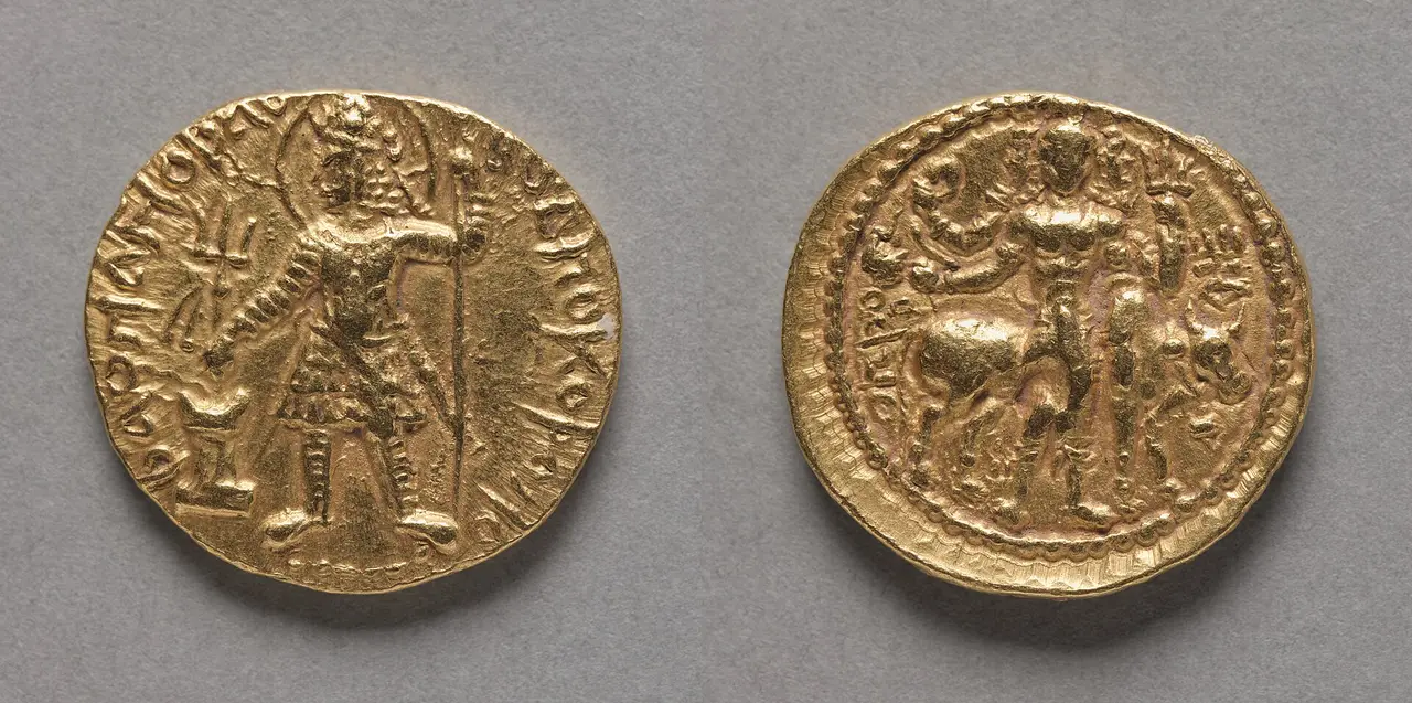 Both faces of an old gold Kushan coin