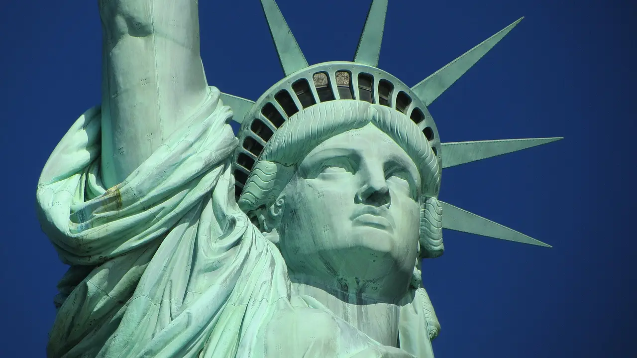 The green copper head and spiked crown of the Statue of Liberty