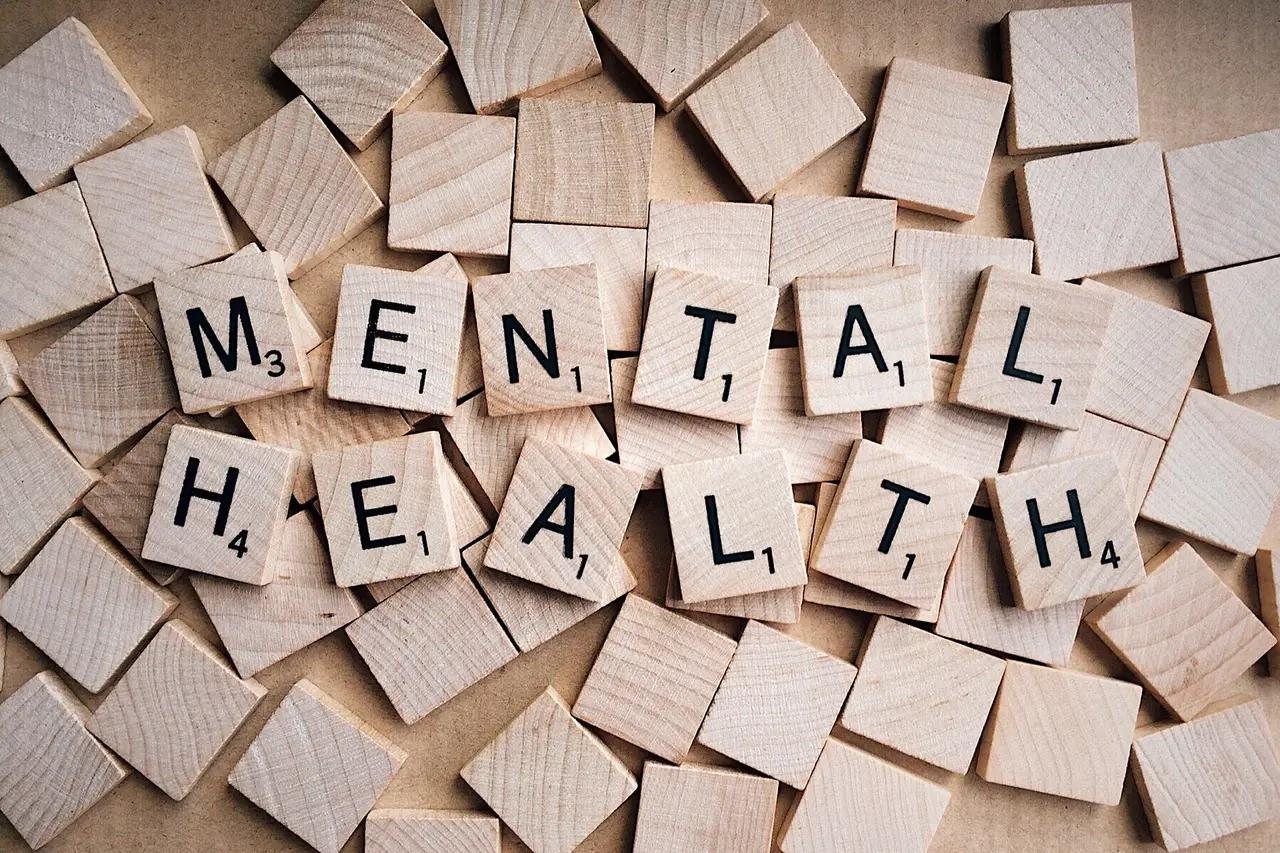 Wooden letter tiles spelling the words mental health