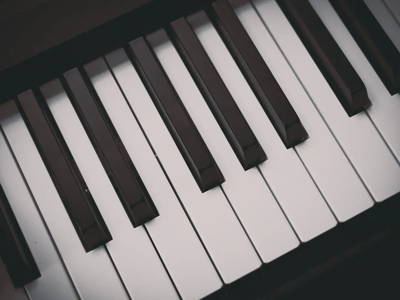 Close-up of black and white piano keys at an angle