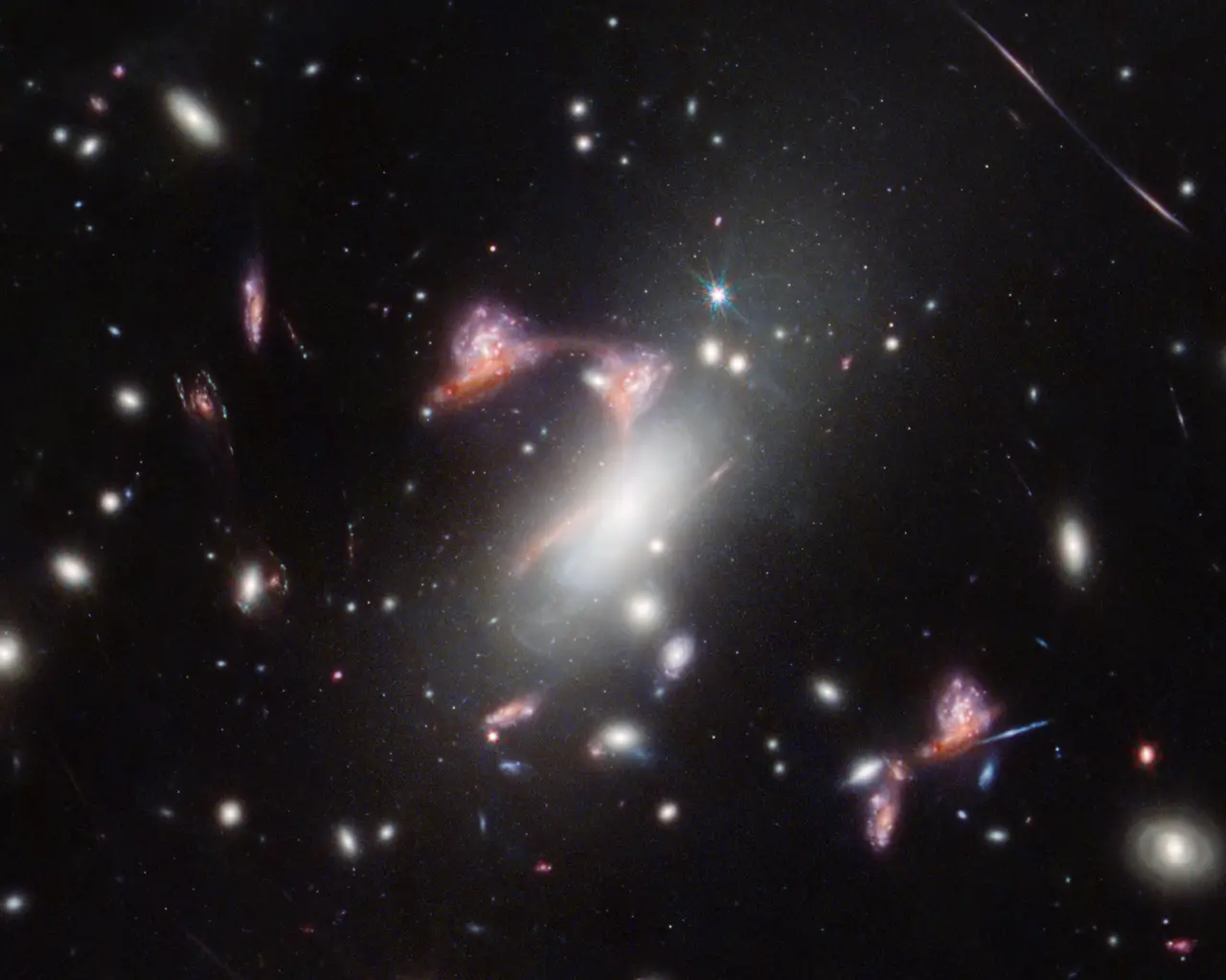 A star field with a faint curved question-mark shape of light