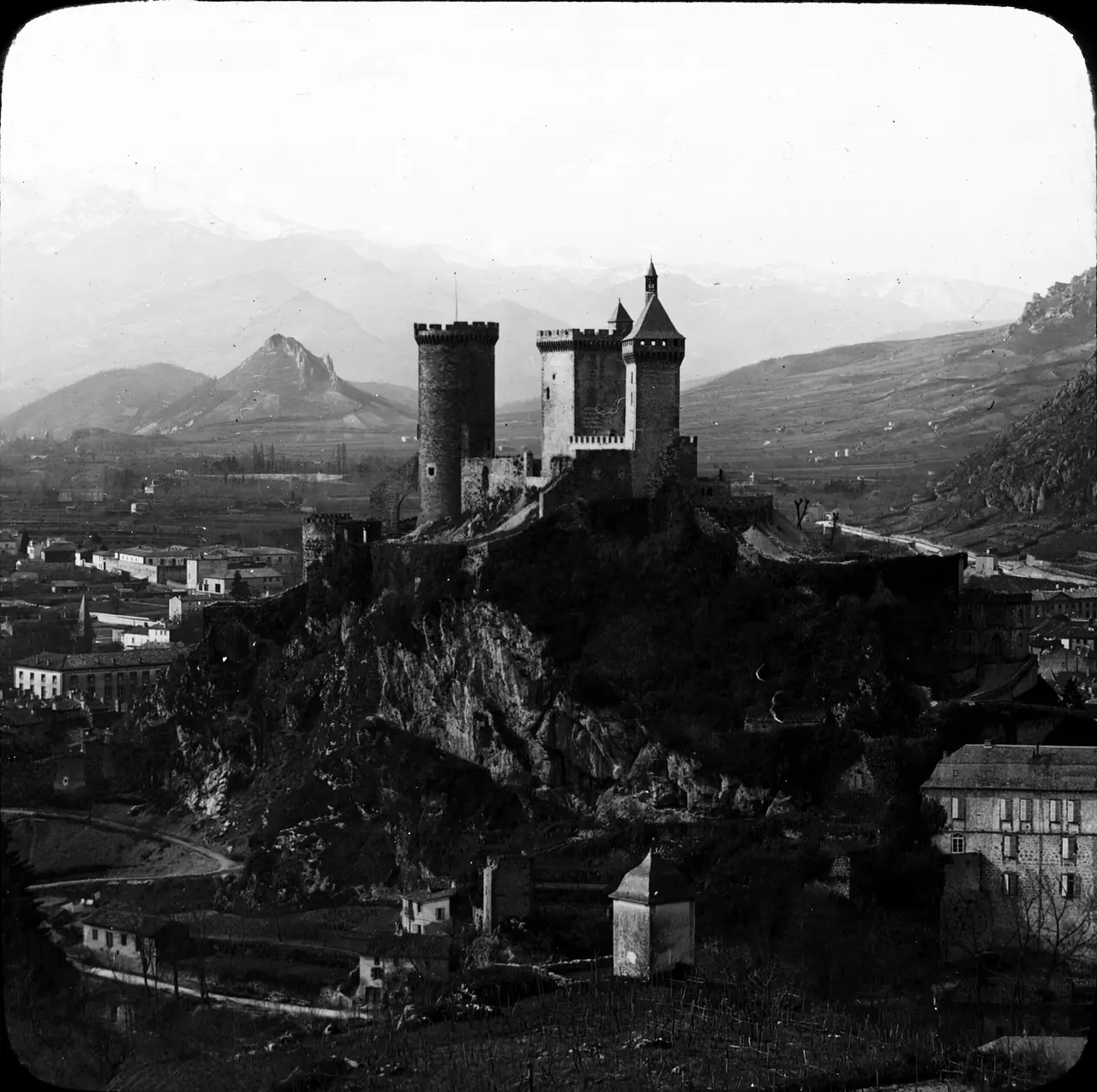 The towers of Foix castle on a hill above the town