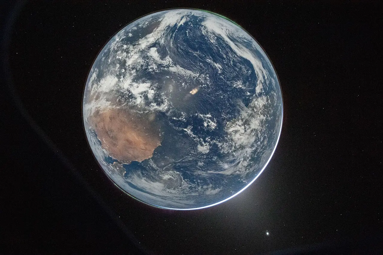 The Earth as a blue and white sphere seen from a spacecraft