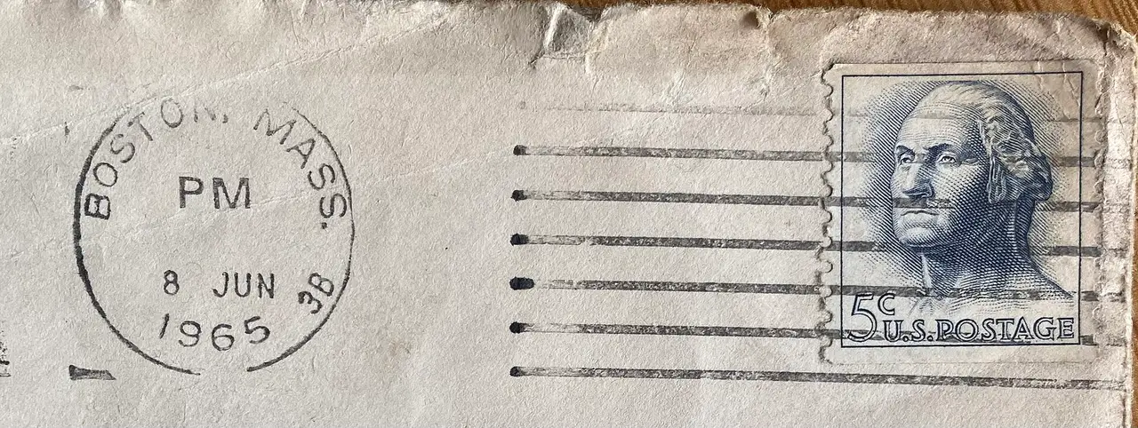 A round postmark over a blue George Washington stamp