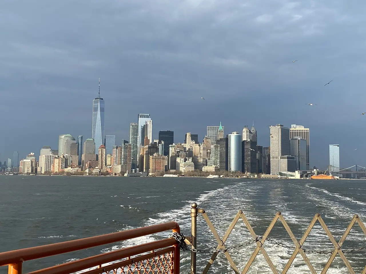 Lower Manhattan skyscrapers across the harbour from a ferry