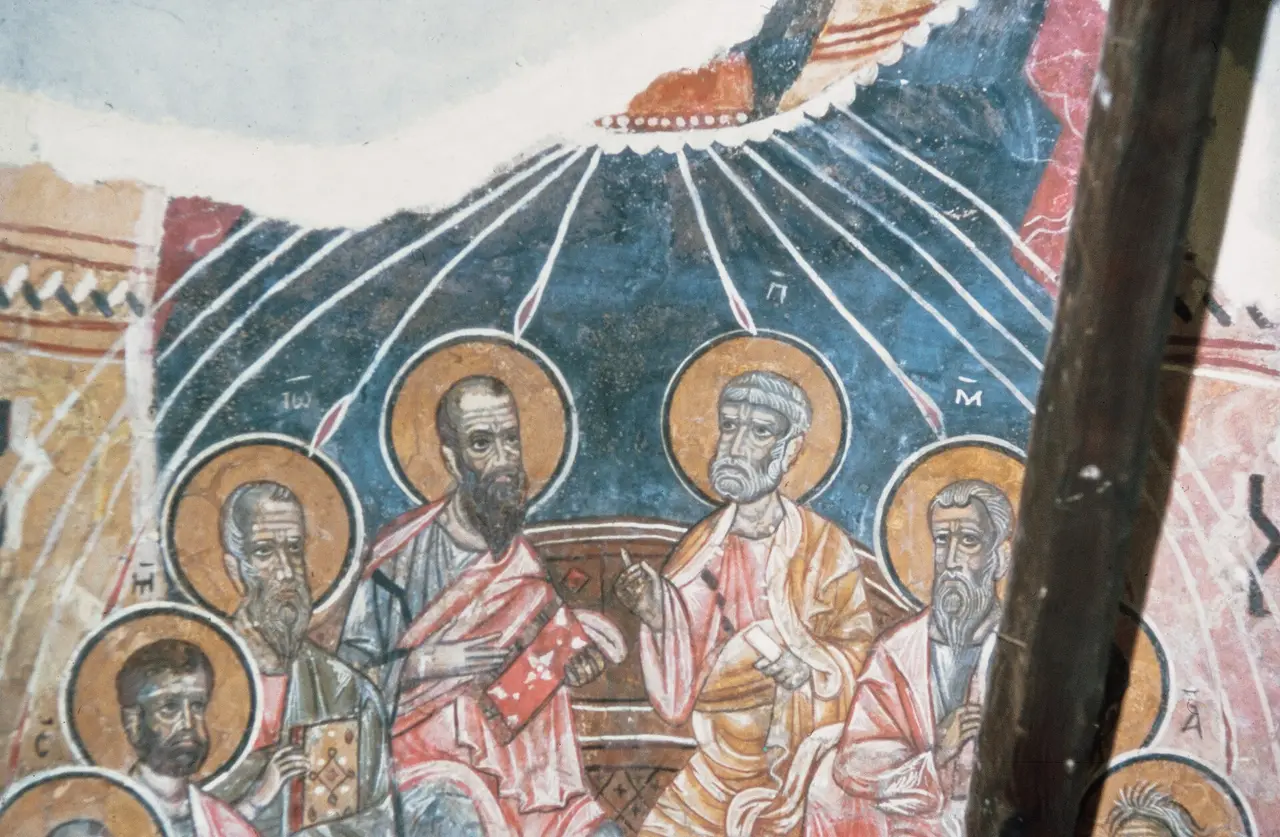 Wall painting of apostles with gold haloes under rays of light