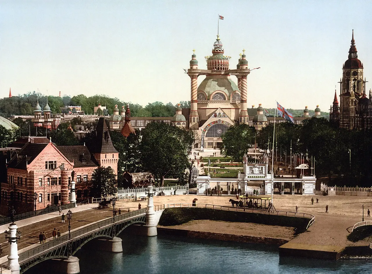 An old colour print of Stockholm with a bridge and exhibition halls