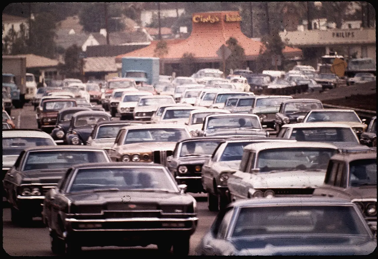 Rows of cars stuck close together in heavy traffic on a Los Angeles freeway