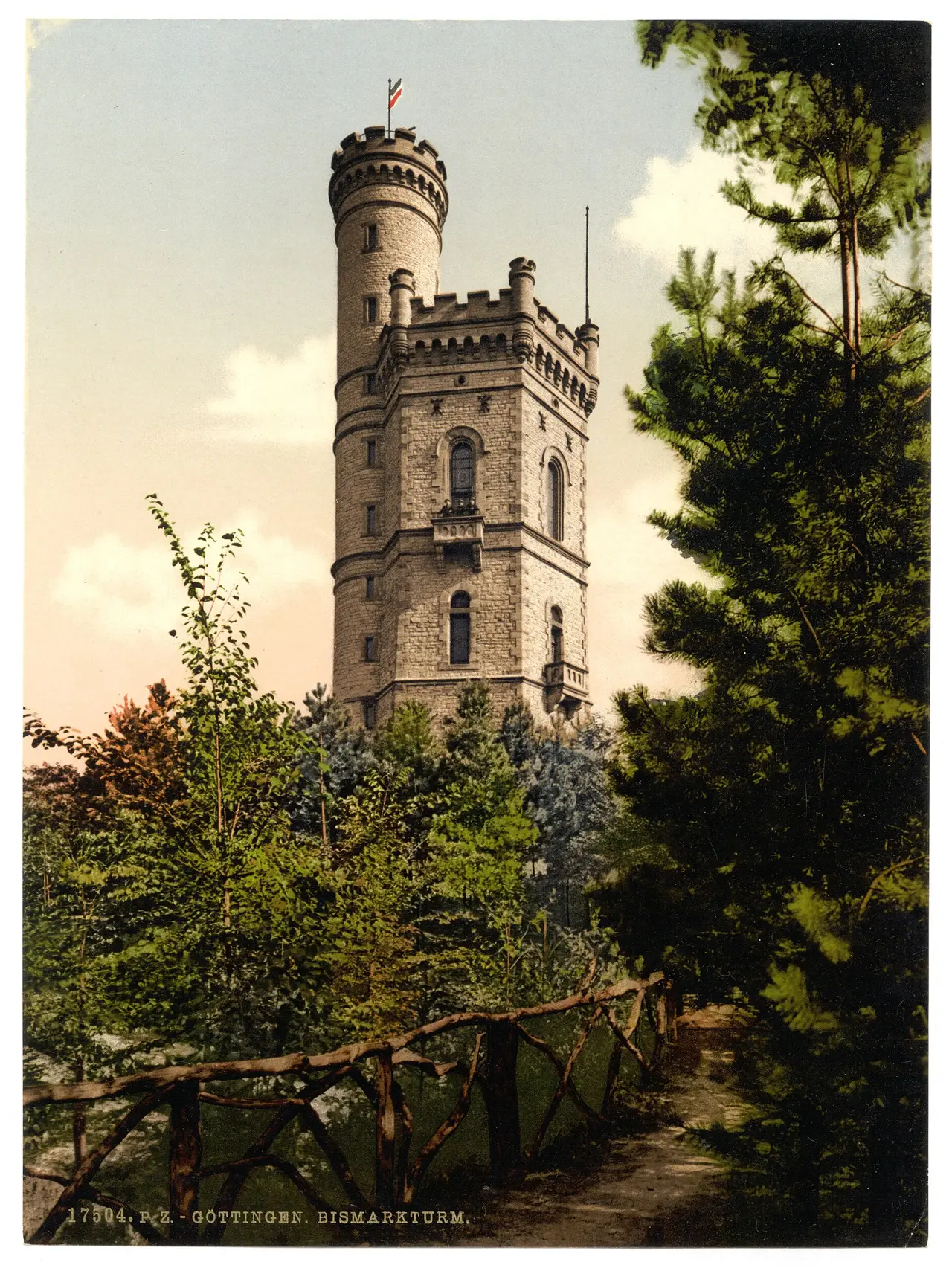 Stone tower rising above pine trees in an old colour print