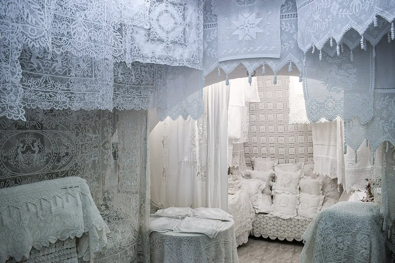 White lace drapes and covers in a room in Mykonos