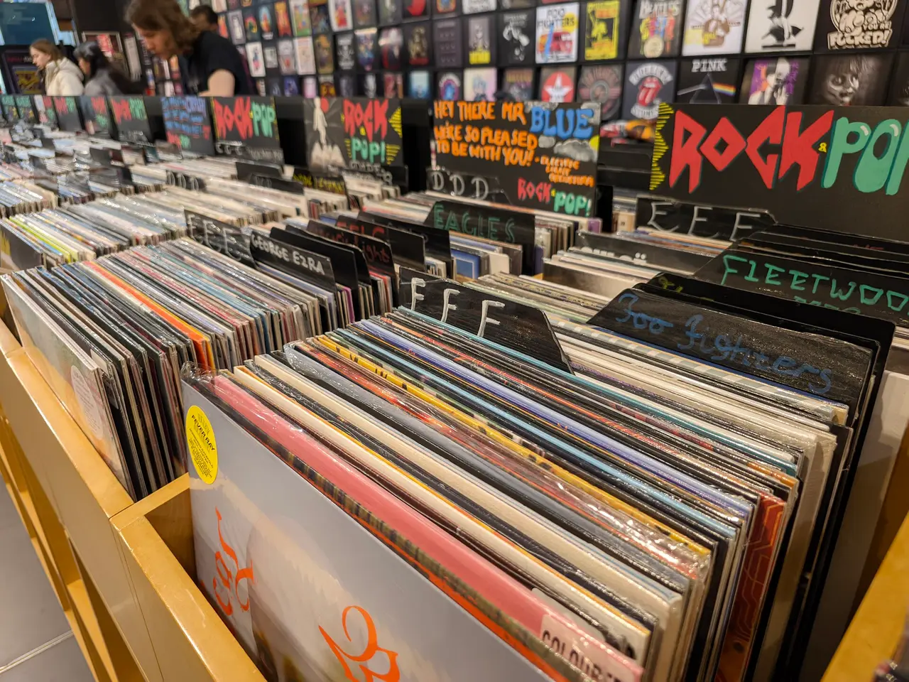 Crates of vinyl records in sleeves in a record shop
