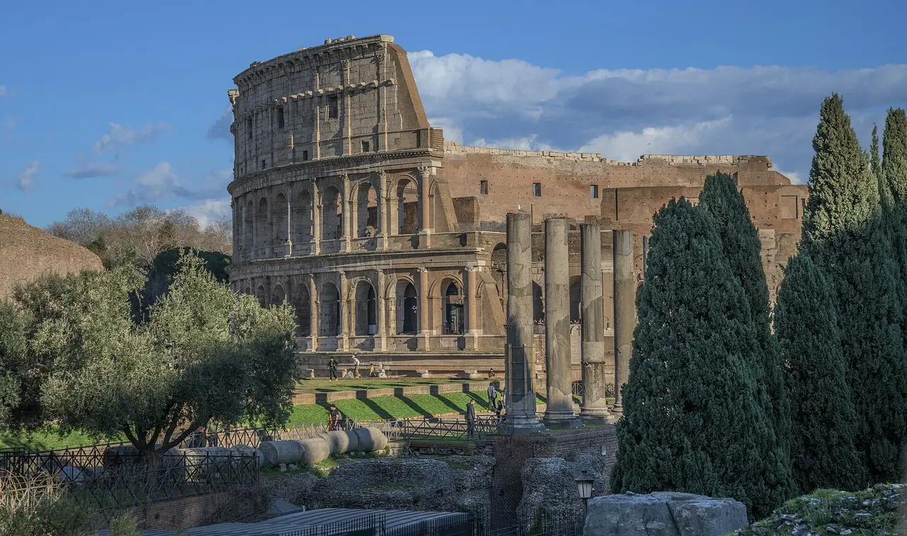 The ruined arena of the Colosseum beside the Roman Forum