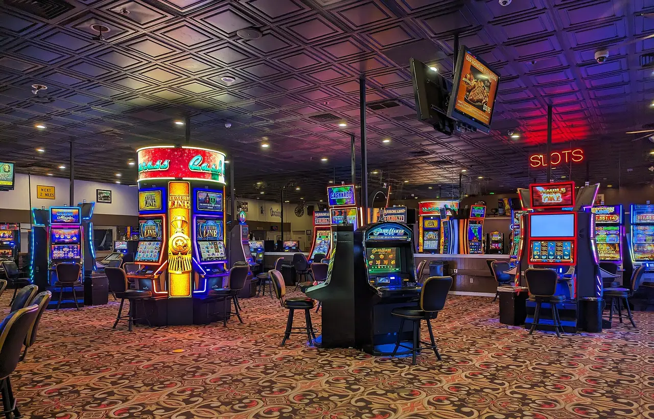 Rows of lit slot machines on a casino floor