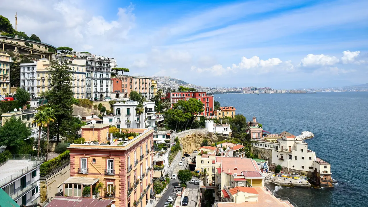 Hillside buildings above the sea along the Naples coast