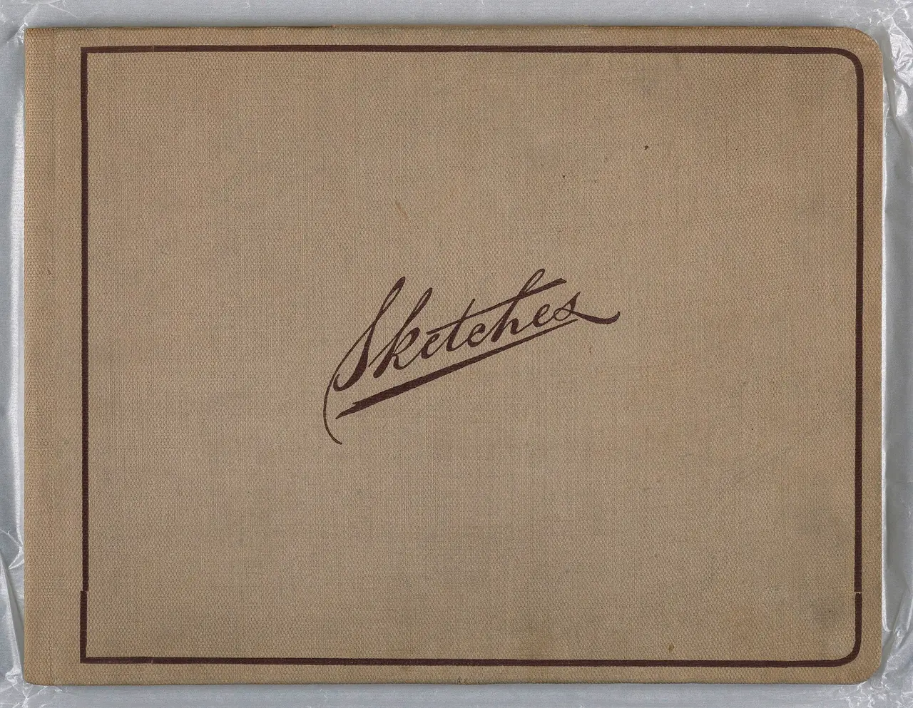 Tan linen sketchbook cover with the word Sketches in script