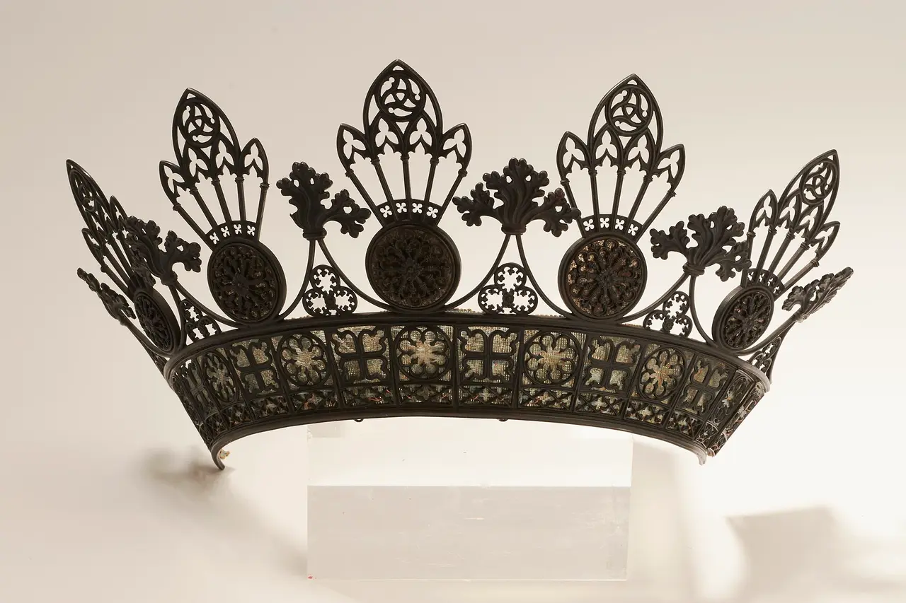 A black cast-iron tiara with pointed openwork crest