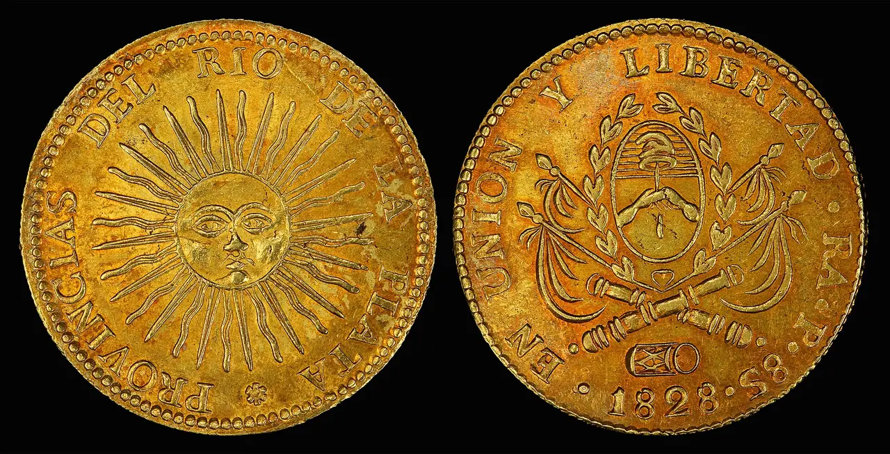 Both faces of a gold coin on a black background