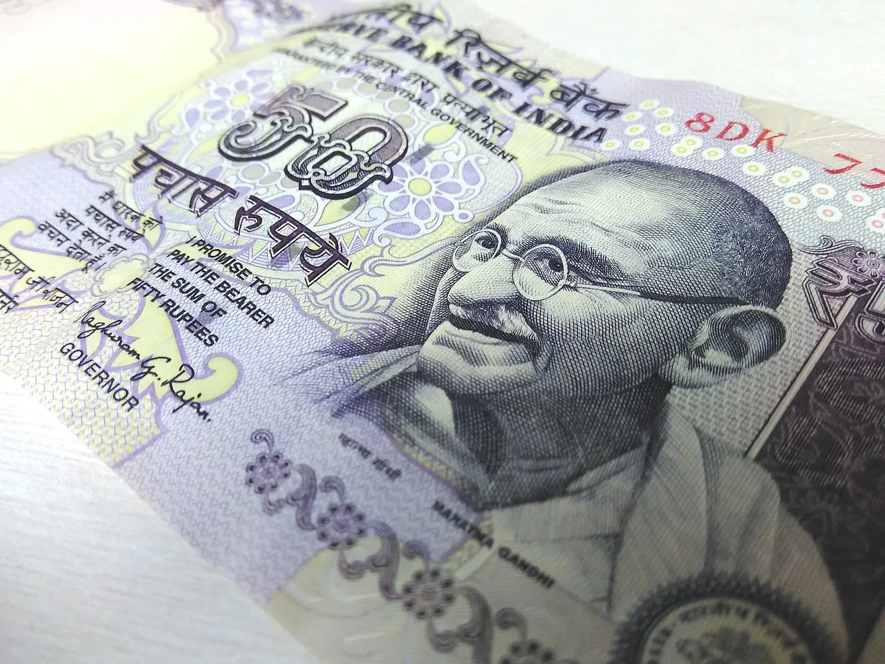 A close view of an Indian 50-rupee note lying at an angle