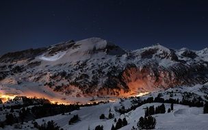 city lights on mountain side at winter night