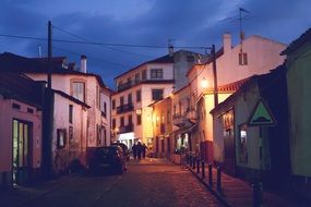 cobblestone street in old town at dusk