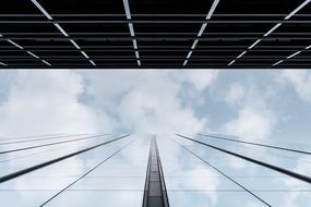 cloudy sky with reflection on office building facade