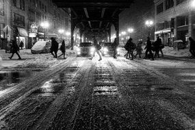 people in night city at winter, black and white