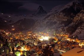 night lights of town at snowy mountain, switzerland