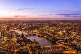 aerial view of illuminated city at dusk, england, london