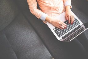 Lady with red nails printing on laptop