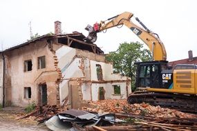 demolition of an emergency building by an excavator
