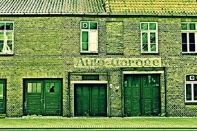 old brick building with wooden doors, garage