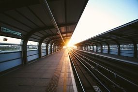 morning sunrays in perspective of subway station