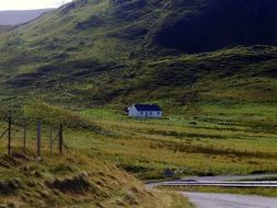 white farmhouse at green mountain, uk, scotland