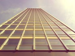 low angle view of tall office building at sky