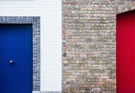 architecture brick wall paint red-blue door