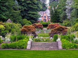 manor house in beautiful formal garden at summer