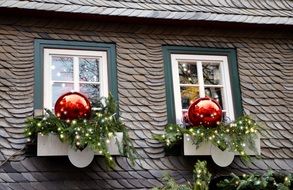 Christmas decorations on the windows of the house