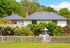 beautiful white village houses in spring garden, uk, england, hampshire, new forest