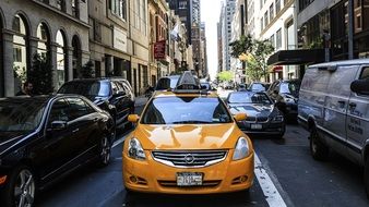 yellow taxi car in street traffic in usa, manhattan, new york city