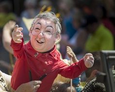 puppet man in person’s hands on street at festival