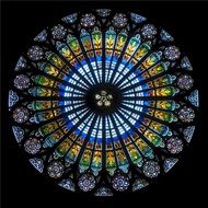 colorful stained glass window of gothic cathedral, france, strasbourg