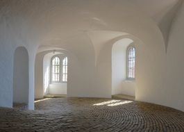 old tower interior with white walls and stone floor in Denmark, copenhagen