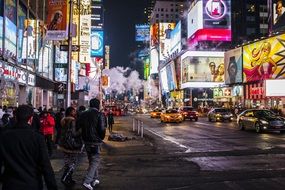 bright illuminated advertising on street of city at night