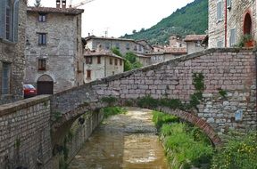 picturesque old stone buildings at mountain, italy, umbria, gubbio