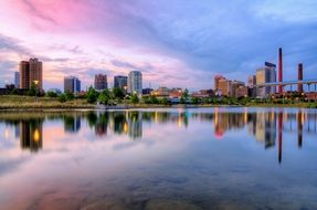 multicolored city reflection buildings lake