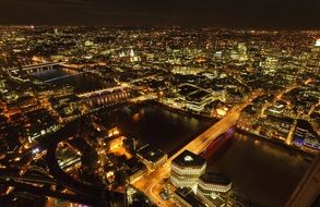 night city panorama with illuminated bridges across thames river, uk, england, london