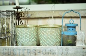 flower pots and lantern in wooden box